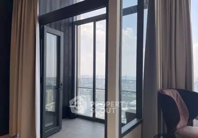 Luxurious high-rise apartment with stunning city view from the balcony, featuring floor-to-ceiling windows.