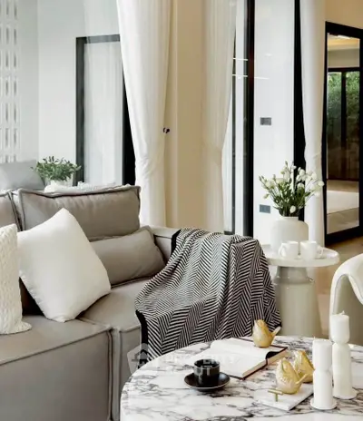 Luxurious modern living room with elegant decor and marble table, perfect for relaxation and entertaining.