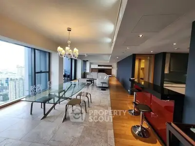 Luxurious open-plan living room with stunning city views and elegant dining area.