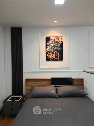 Modern bedroom with stylish decor and cozy bedding