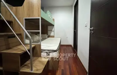Modern bedroom with stylish bunk bed and wooden flooring