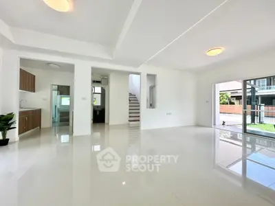 Spacious modern living room with glossy tile flooring and open layout