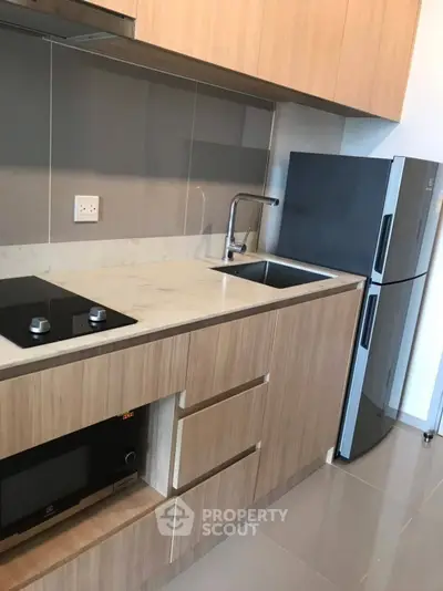 Modern kitchen with sleek cabinetry and stainless steel appliances