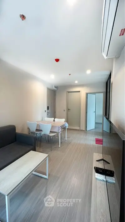 Modern living room with sleek furniture and open layout, perfect for urban living.