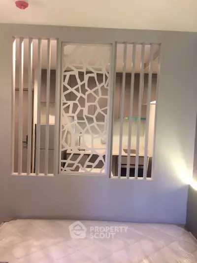 Modern bedroom with stylish partition and cozy ambiance