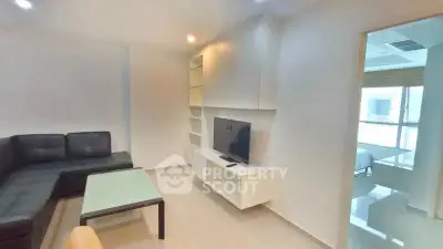 Modern living room with sleek furniture and built-in TV unit