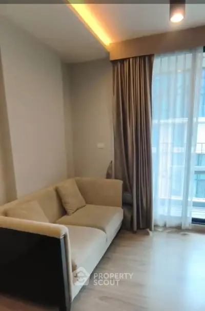 Cozy living room with modern sofa and floor-to-ceiling window