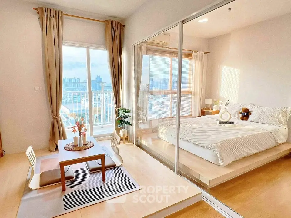 Modern apartment with cozy bedroom and city view, featuring elegant decor and natural light.