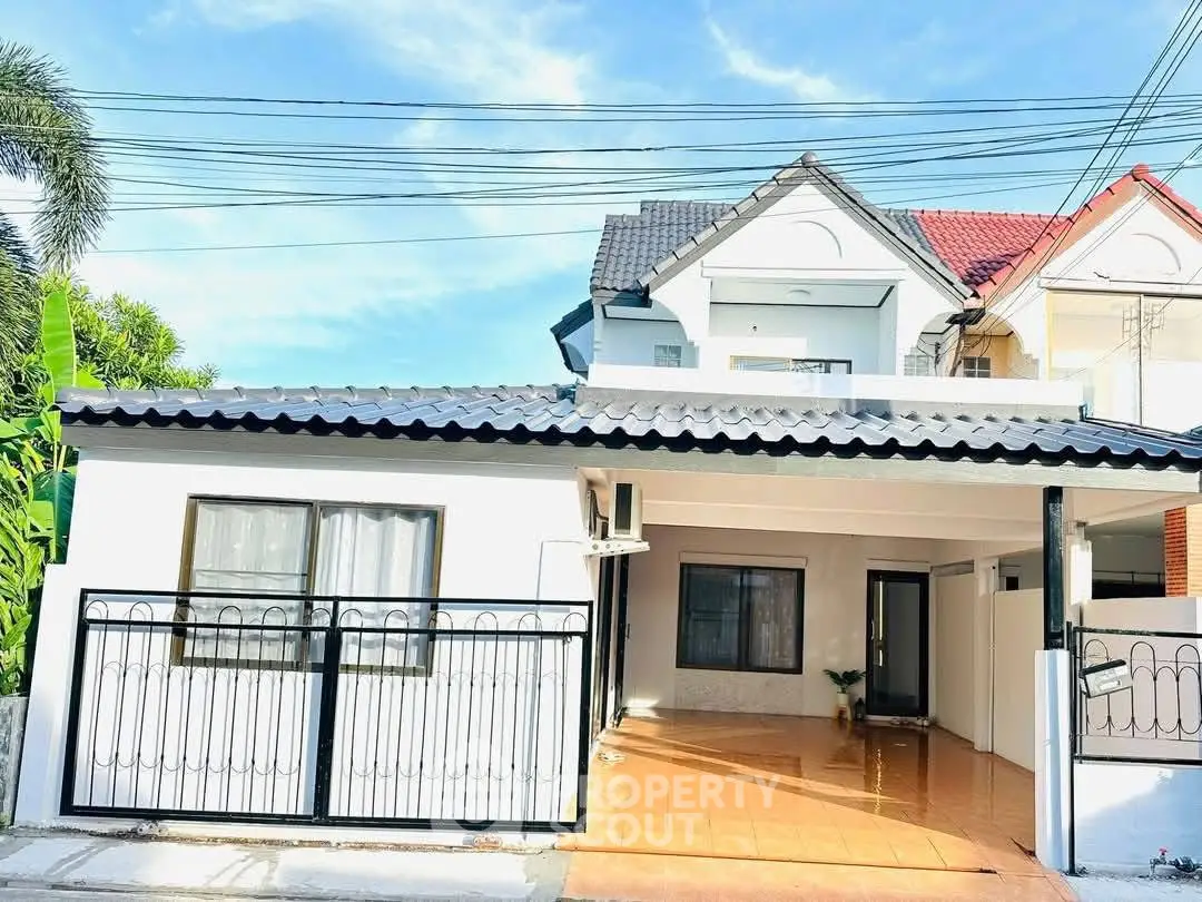 Charming suburban house with spacious driveway and modern exterior design.