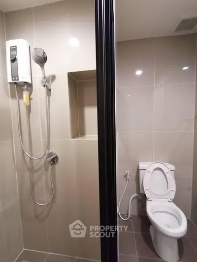 Modern bathroom with shower and toilet in sleek design