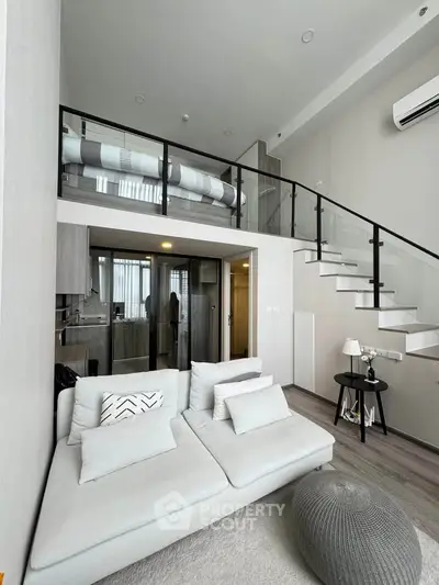 Modern loft apartment with stylish living room and mezzanine bedroom