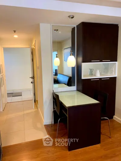 Modern apartment interior with stylish dining area and sleek cabinetry