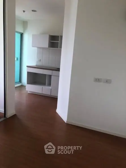 Modern apartment interior with open layout and wooden flooring