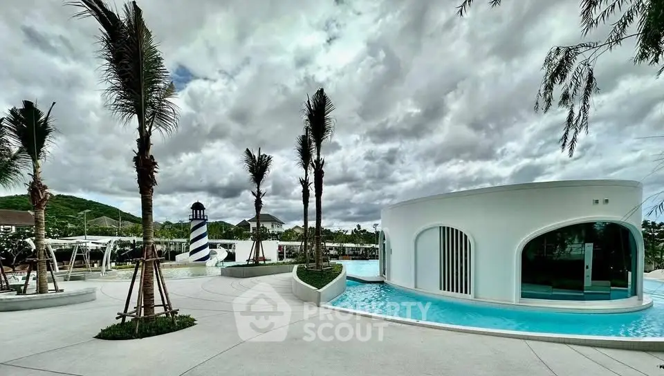 Stunning modern poolside architecture with palm trees and unique design elements.