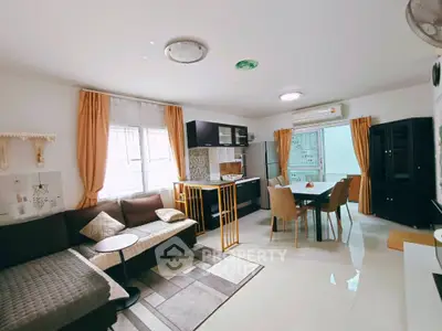 Spacious open-layout living room with modern kitchen and dining area
