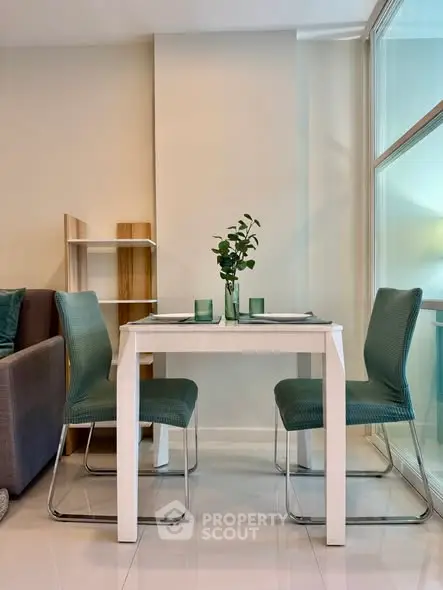 Modern dining area with sleek table and chairs in a stylish apartment