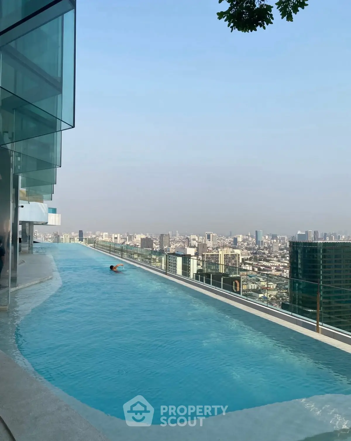 Stunning rooftop infinity pool with panoramic city skyline view