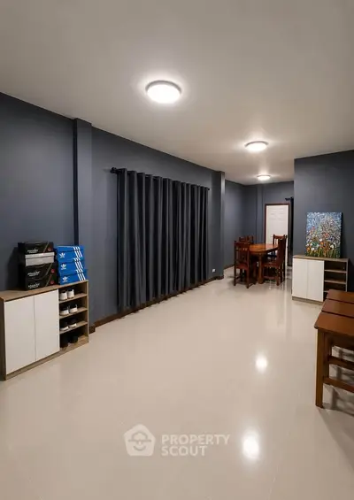 Spacious modern living area with sleek furniture and elegant decor, perfect for stylish urban living.