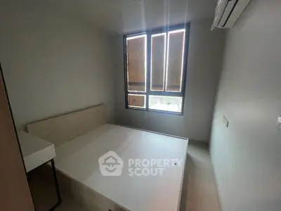 Cozy minimalist bedroom with natural light and air conditioning