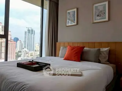 Modern bedroom with city view and stylish decor