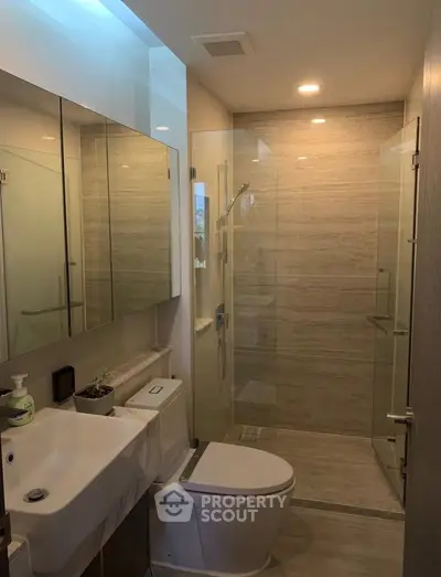 Modern bathroom with glass shower and sleek fixtures