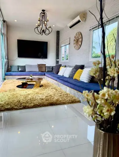 Luxurious living room with elegant chandelier and spacious seating area
