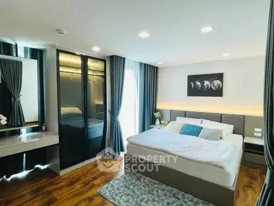 Spacious modern bedroom with elegant decor and ample natural light