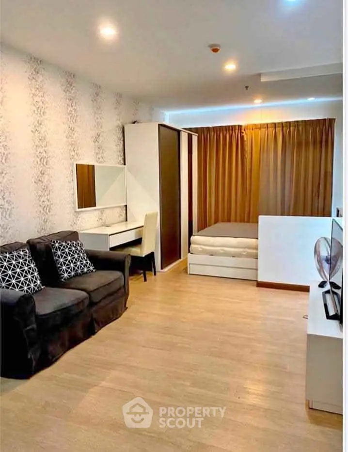 Modern studio apartment with stylish decor and cozy living area, perfect for urban living.
