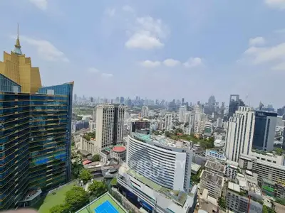Stunning cityscape view from a high-rise building showcasing urban skyline and modern architecture.