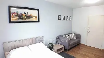 Modern bedroom with cozy sofa and stylish decor in a bright apartment