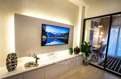 Modern living room with stylish decor and open view to dining area