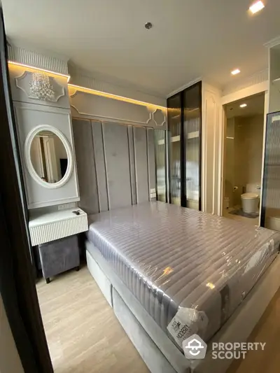 Luxurious modern bedroom with elegant decor and ensuite bathroom