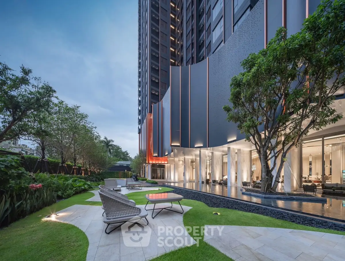 Luxurious modern building exterior with landscaped garden and stylish outdoor seating.