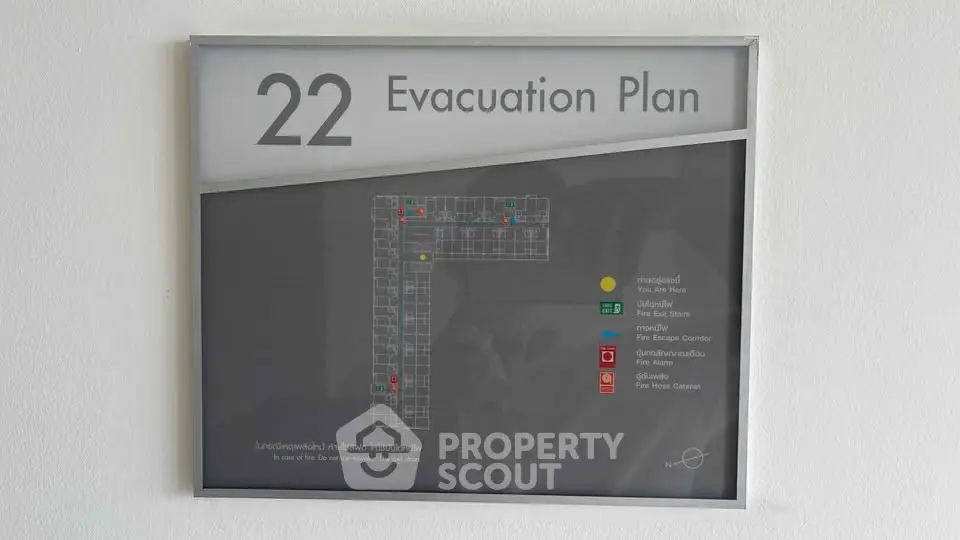 Floor 22 evacuation plan in a modern building, showcasing safety routes and emergency exits.