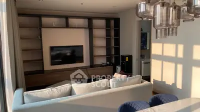 Modern living room with stylish shelving and elegant lighting