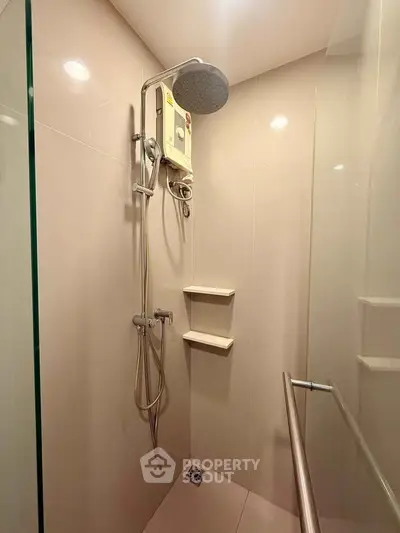 Modern bathroom with sleek shower design and built-in shelves