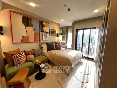 Stylish bedroom with modern decor and balcony access in a luxurious apartment.