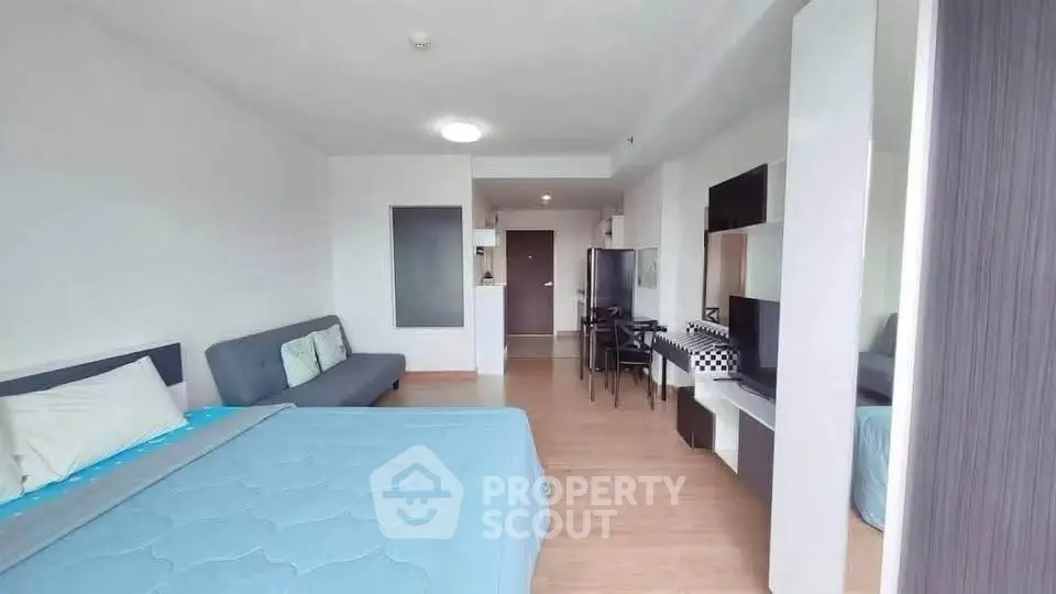 Modern studio apartment with open layout and stylish furnishings, perfect for urban living.