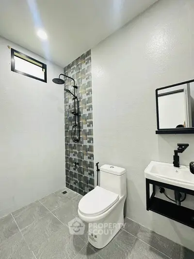 Modern bathroom with sleek fixtures and stylish tile accents