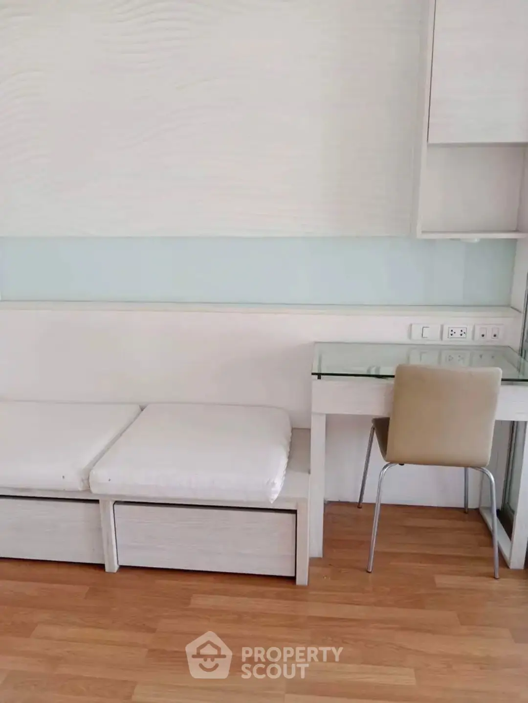 Modern minimalist study area with sleek desk and chair on wooden flooring