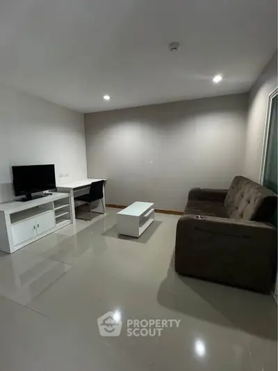 Modern living room with sleek furniture and neutral tones