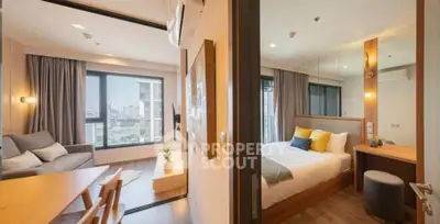 Modern apartment interior with cozy living room and stylish bedroom, featuring large windows and elegant decor.