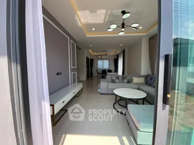 Modern living room with stylish furniture and elegant lighting in a contemporary home.