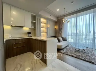 Luxurious open-layout kitchen and living room with city view, modern decor, and elegant lighting.