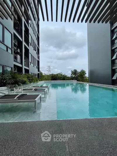 Luxurious modern apartment with stunning rooftop pool and scenic views.