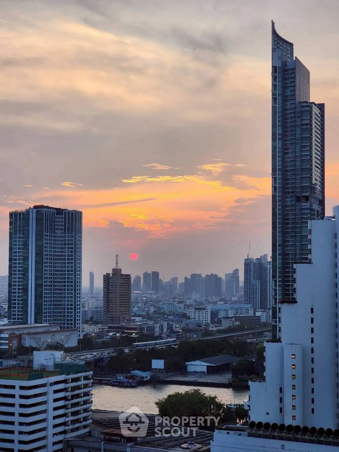 Stunning cityscape view with modern skyscrapers at sunset, perfect for urban living enthusiasts.