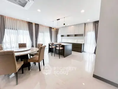 Spacious modern dining area with elegant furnishings and natural light