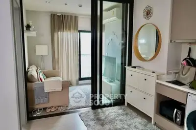 Chic modern living room with cozy sofa, stylish decor, and open layout in urban apartment.