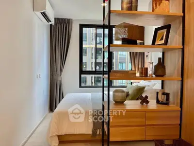 Modern bedroom with stylish decor and large window in urban apartment