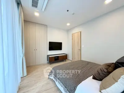Modern bedroom with stylish decor and built-in wardrobe
